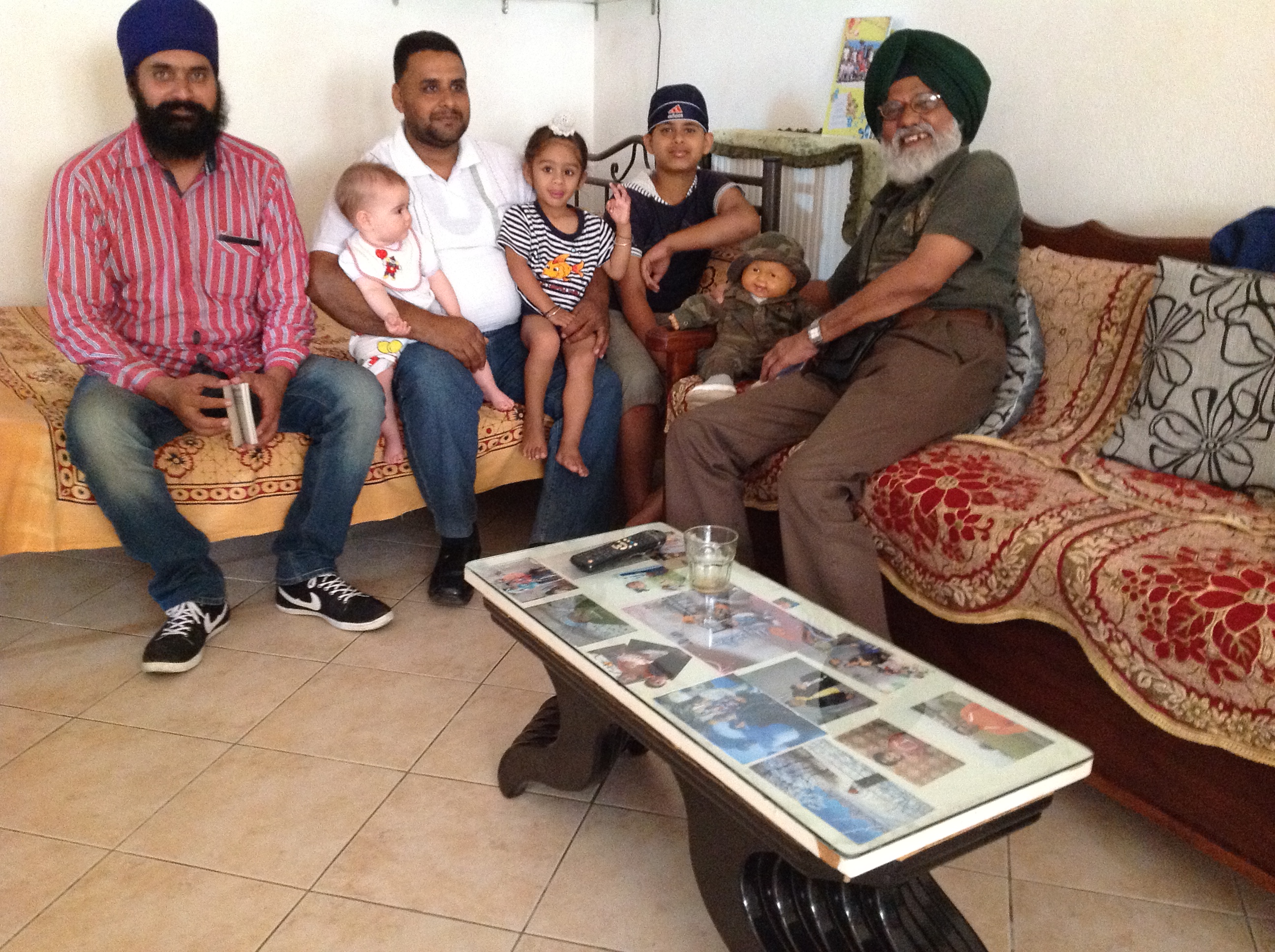 Greece Crete Sikh Family who are so well liked by their landlord that they feel free to leave their baby with them when away from home